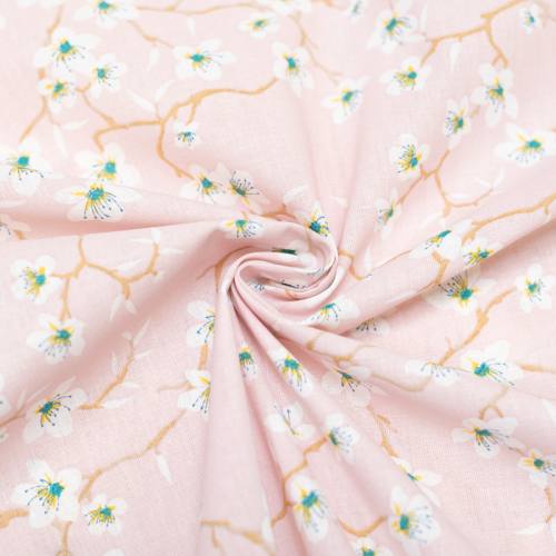 Coton rose dragée motif fleur d'amandier blanche