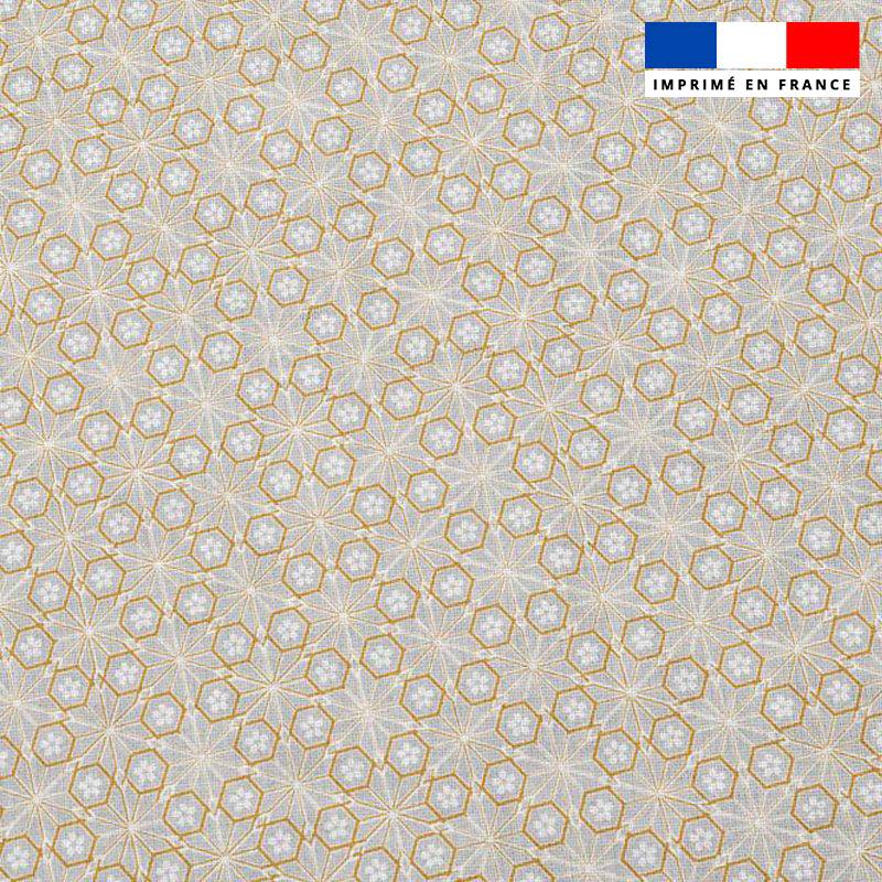 Popeline de coton beige peigné motif Asanoha doré fleur blanche